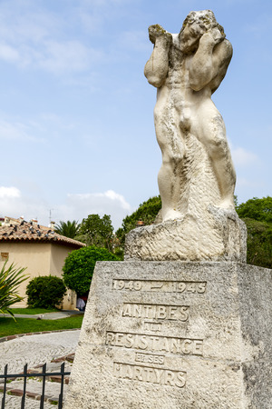 ANTIBES, FRANCE - MAY 30, 2012  Memorial commemorates  the martyrs of the resistance movement in the city during the World War II, figure shows the character struggling with a heavy load of sorrowのeditorial素材