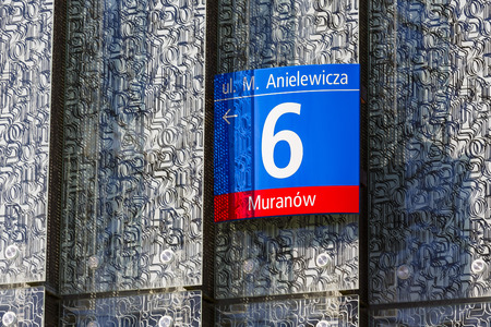 WARSAW, POLAND - MARCH 29, 2014  Address board mounted on a made of glass, artistic facade of Museum...