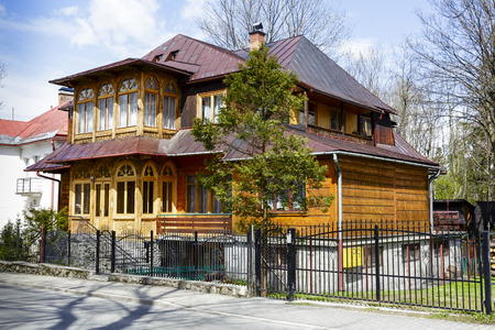 ZAKOPANE, POLAND - APRIL 20, 2014  Wooden Villa Zacisze built in 1908, formerly elegant guest house, with historic features listed in the municipal register of architectural heritage of the city  のeditorial素材