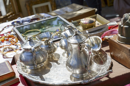 NICE, FRANCE - MAY 17, 2014  Old Silver Tableware for sale at the antique market, held on Saturdays, on the built late 18th century Garibaldi square, located at the outskirts of the Old Townのeditorial素材