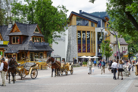 ZAKOPANE, POLAND - JUNE 27, 2014  Shopping Gallery in the new building, designed by Jacek Budzinski opened in 2014 at Krupowki, the main shopping area and pedestrian promenade in the city centerのeditorial素材