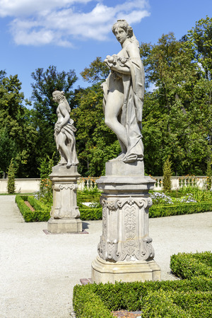 WARSAW, POLAND - AUGUST 20, 2014: Garden Sculptures in the Wilanow park created in the 2nd half of the 17th century together with the Royal Palace built for King Jan III Sobieskiのeditorial素材