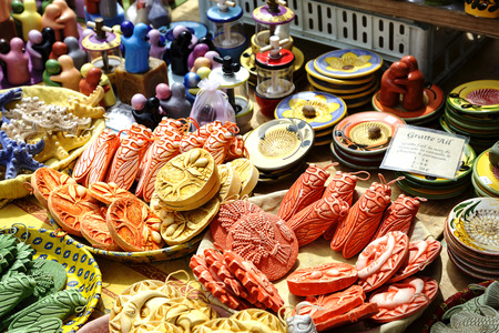 NICE, FRANCE - MAY 11, 2014: Ceramics exposed for sale on Cours Saleya, most famous City market, offers various gifts, flowers also antiques and other productsのeditorial素材