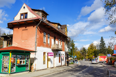 ZAKOPANE, POLAND - OCTOBER 16, 2014: The Urban Property with several elements of the Zakopane Style offers service and retail shop located on the ground floorのeditorial素材