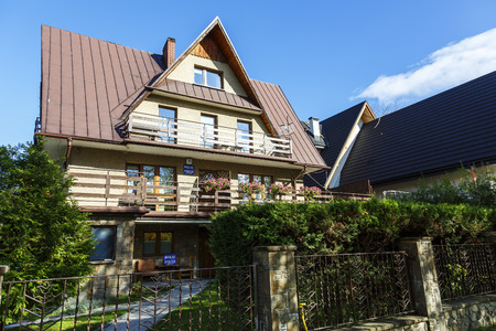 ZAKOPANE, POLAND - OCTOBER 14, 2014: Contemporary villa in the style of the region, located in the City center, offers holiday stays for guests arriving to the cityのeditorial素材