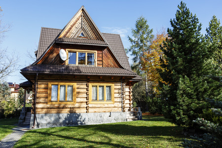 ZAKOPANE, POLAND - OCTOBER 14, 2014: Residential house, wooden villa built in 1953 in the architectural style typical of the regionのeditorial素材