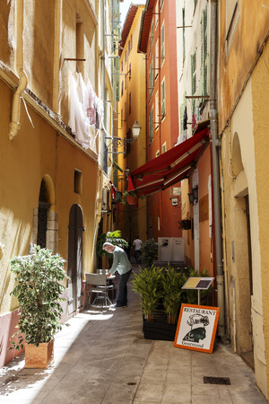 NICE, FRANCE - MAY 16, 2014: Narrow streets in the Old Town shows the detail of historic part of the city between Massena Square in the west, Castle Hill on the east and Square Garibaldiのeditorial素材