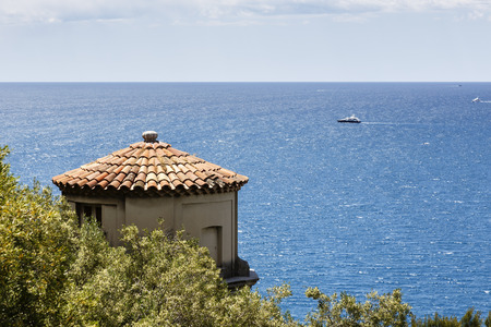 NICE, FRANCE - MAY 15, 2014: The tower, part of the architecture of the Castle Hill seen on the background of the sea, probably its origin date back 1640 and restored at the end of 19th centuryのeditorial素材