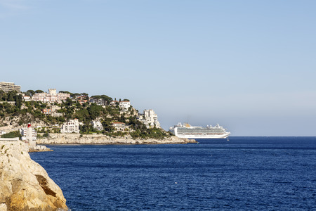 NICE, FRANCE - MAY 18, 2014: P&O Luxury Cruise Ship departs from roadstead Villefranche-sur-Mer and is visible behind Mont Boron, located on the eastern edge of Niceのeditorial素材