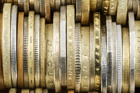 Various coins shown up close, forms the backdrop Various coins shown up close, forms the backdrop