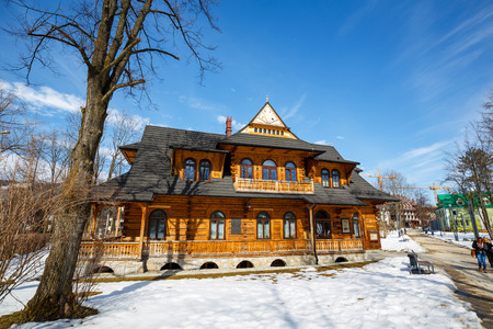ZAKOPANE, POLAND - MARCH 10, 2015: Villa Jutrzenka built in the style of Zakopane in 1900, nowadays the seat of Tatra Culture and Sport Centre, Gallery Art-Park and Art Museumのeditorial素材