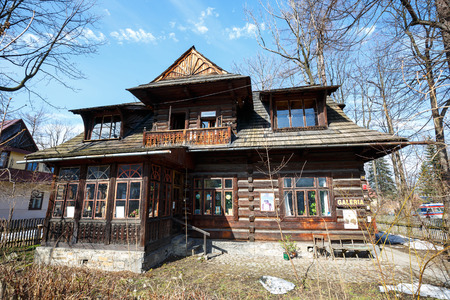 ZAKOPANE, POLAND - MARCH 10, 2015: Wooden residential building dates from 1897, was owned by a well-known doctor Waclaw-Kraszewski since 1912. Gallery of Modern Art since 1993のeditorial素材