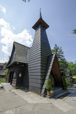 ZAKOPANE, POLAND - JUNE 09, 2015: Church of the Salvatorian Priests, built of wood in years 1956-1968, architects have joined in the project the architectural style of Zakopane and modern for its timeのeditorial素材