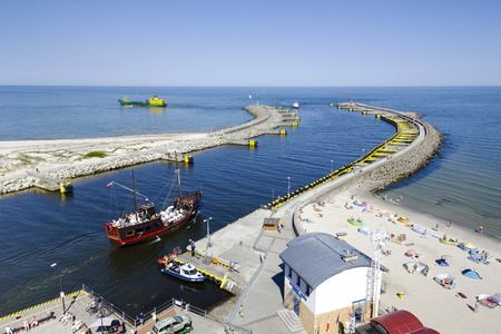 KOLOBRZEG, POLAND - JULY 17, 2015: Breakwater Eastern of the seaport, opened after the reconstruction of the entrance to the port of Kolobrzeg in 2012のeditorial素材