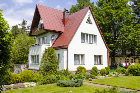 ZAKOPANE, POLAND - JUNE 10, 2015: The brick construction house, situated in a residential area of the city, offers 11 beds for short-term tourist accommodationのeditorial素材