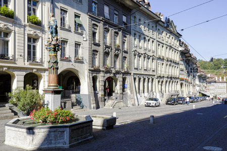 BERN, SWITZERLAND - SEPTEMBER 13, 2015: Townhouses at the most visited street in the old city of Bern, the old town of Bern became a UNESCO World Heritage Site since 1983のeditorial素材