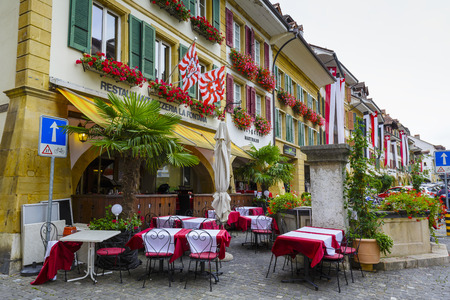 MORAT, SWITZERLAND - SEPTEMBER 15, 2015: The townhouses at the most visited street in the old city of Morat Murten with a population of approx. 6,500 citizens. German and French linguistic regionのeditorial素材