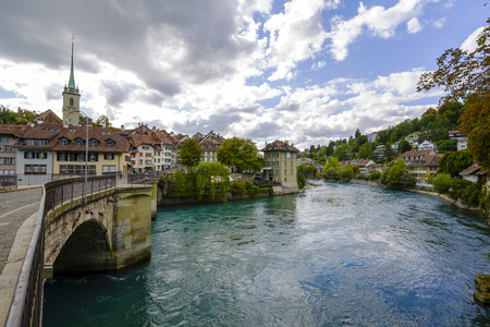 BERN, SWITZERLAND - SEPTEMBER 06, 2015: The river Aare flows through the city of Bern with a population of approx. 140000 citizens . Aare is the longest river in the country with 295 km in lengthのeditorial素材