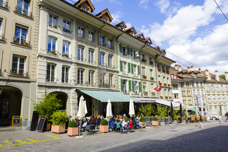 BERN, SWITZERLAND - SEPTEMBER 06, 2015: Townhouses at the most visited street in the old city of...