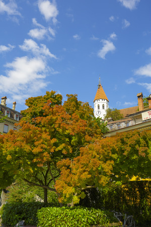 THUN, SWITZERLAND - SEPTEMBER 08, 2015: Medieval tower approx. 1330 of the city church Stadtkirche located on the castle hill and belongs to the citys main Reformed church towering over the cityのeditorial素材