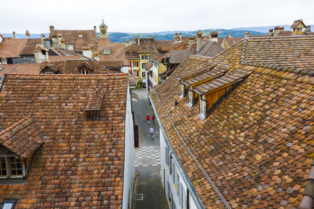 MURTEN MORAT, SWITZERLAND - SEPTEMBER 15, 2015: A view towards city roofs, seen from Town Rampart Walls, in the city with a population of approx. 6500 citizens. German and French linguistic regionのeditorial素材