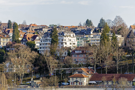 BERN, SWITZERLAND - DECEMBER 22, 2015: Houses in Bern seen in the distance. The Capital City of Switzerland it is the 4th most populous city in Switzerlandのeditorial素材