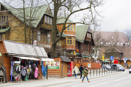 ZAKOPANE, POLAND - MARCH 07, 2016: Wooden building until 1898 the biggest hotel in Zakopane. Nowadays it houses famous Gazdowo-Kuznia restaurant and milk-barのeditorial素材