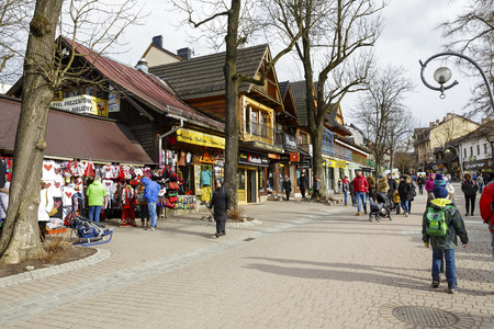 ZAKOPANE, POLAND - MARCH 06, 2016: General view at Krupowki street. It is main shopping area and pedestrian promenade in the downtown is very famous and frequently visited by touristsのeditorial素材