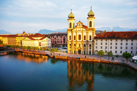 LUCERNE, SWITZERLAND - MAY 02, 2016: Evening view towards the Jesuit Church located by the Reuss river in old town. It is widely believed to be the most beautiful Baroque church in Switzerlandのeditorial素材