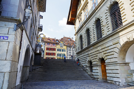 LUCERNE, SWITZERLAND - MAY 02, 2016: View towards colorful buildings at the square in the old town. This square is called Kornmarkt and offers variety of sightseeing attractionsのeditorial素材