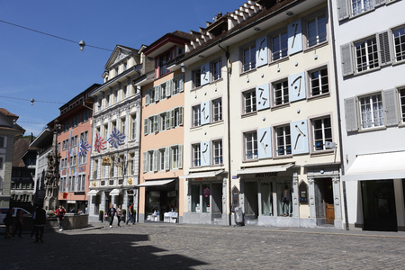 Lucerne, Switzerland - May 06, 2016: Historic buildings at the Weinmarkt in the combination with decorated fountain in the square show a variety of tourist attractions. These attractively decorated buildings are located almost in the center of the old towのeditorial素材