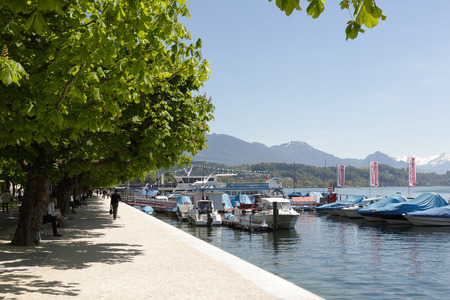 LUCERNE, SWITZERLAND - MAY 06, 2016: Promenade along the shore of Lake Lucerne is a walking place frequently visited by many tourists because of the magnificent views that can be seen from hereのeditorial素材