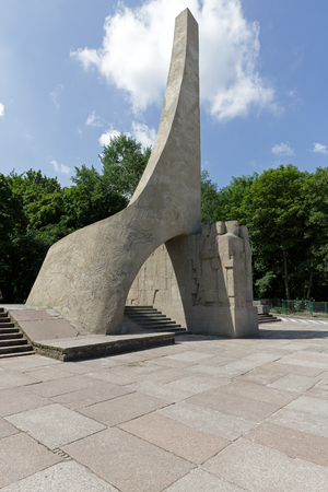 KOLOBRZEG, POLAND - JUNE 22, 2016: Modernist monument presents a symbolic flag that is carried by a human figures, it symbolizes the thousand year tradition of the Polish army in Pomeraniaのeditorial素材