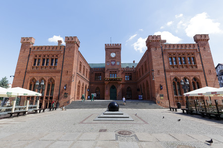 KOLOBRZEG, POLAND - JUNE 23, 2016: View  towards front facade of the neo-Gothic building of Town Hall that was built from 1829 to 1832 and rebuilt in 1913のeditorial素材
