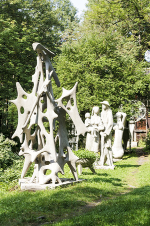ZAKOPANE, POLAND - SEPTEMBER 15, 2016: Exhibition of outdoor sculptures placed among the greenery in front of a studio. All those sculptures are by artist Henry Burzec who was born 1919 died 2005のeditorial素材