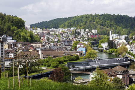 LUCERNE, SWITZERLAND - MAY 04, 2016: Aerial view towards residential buildings and among them a lot of trees and Reuss river can be seenのeditorial素材