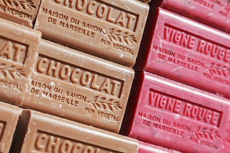 Nice, France - May 16, 2014: Two fragrances of soap bars with different colors. Those traditional soaps made of vegetable oils was put on sale at the local marketのeditorial素材