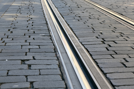 In the cobbled road surface there are tram tracks that are visible in Bern, Switzerlandの写真素材