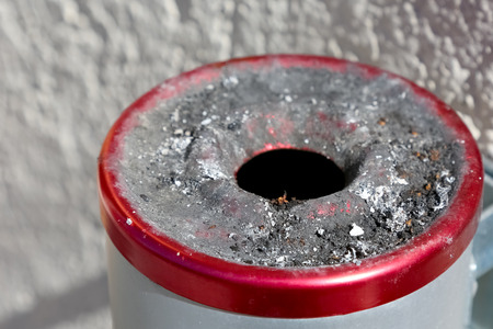The ashtray has been used and there the smoked cigarettes left dirt that is visible on the steel...