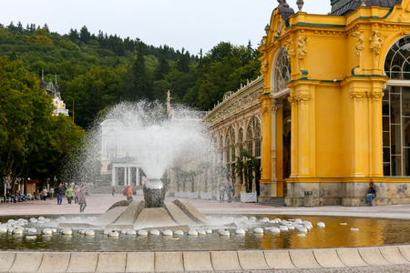 Marianske Lazne, Czechia - September 09, 2017: The Singing Fountain and building of the Colonnade dominates the promenade in the local park being one of the most visited places in this city.のeditorial素材