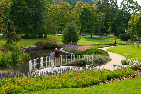 Marianske Lazne, Czechia - September 09, 2017: Curved park alleys, a river and green areas in the city are designed to create a friendly space for communicating with nature in the city centre.のeditorial素材