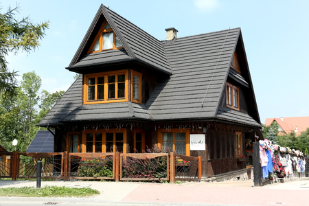 Zakopane, Poland - August 17, 2017: The restored building is covered with a sloping roof with many slopes. Currently there is a guesthouse called Willa Art.のeditorial素材