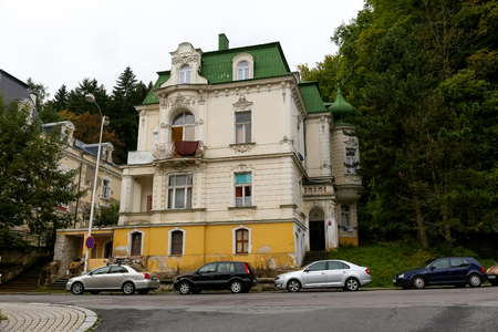 Marianske Lazne, Czech Republic - September 10, 2017: Old but beautiful residential house and cars parked on the street can be seen in this spa townのeditorial素材