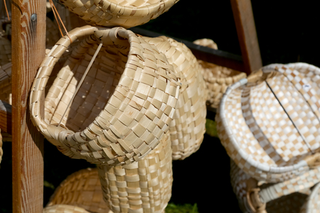 Zakopane, Poland - August 15, 2017: Variety of baskets made of various natural and synthetic materials put up for sale during a regional products fair.のeditorial素材
