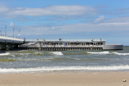 Kolobrzeg, Poland - June 13, 2017: The restaurant, located at the end of a massive concrete pier, is the destination of many tourists who come here and enjoy a magnificent view and sea breeze.のeditorial素材
