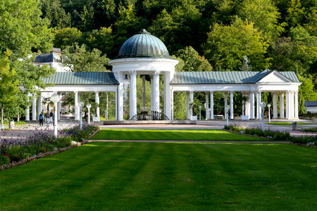Marianske Lazne, Czech Republic - September 12, 2017: The lawn at the front and the trees at the back give the impression that the Caroline Spring Colonnade is surraunded with greenery.のeditorial素材