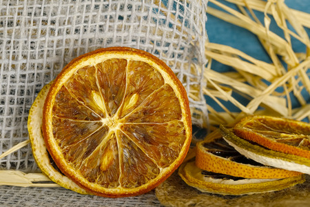 Slices of dried citrus fruit are shown together with other elements.の写真素材