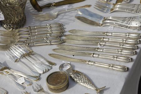 Nice, France - 17 September 2018: On the flea market in Cours Saleya, the famous city market offering antiques and many other products, you can see a variety of used cutlery.のeditorial素材