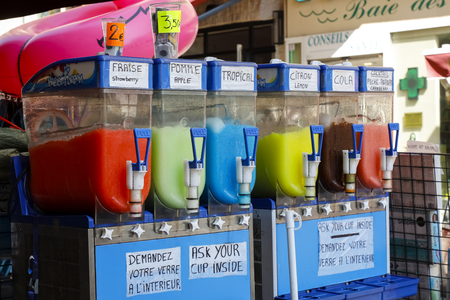 Nice, France - September 19, 2018: Self service outdoor stand from which you can buy a drink, as you can see in different flavors and colors. You only need to ask your cup inside of this beverage shopのeditorial素材