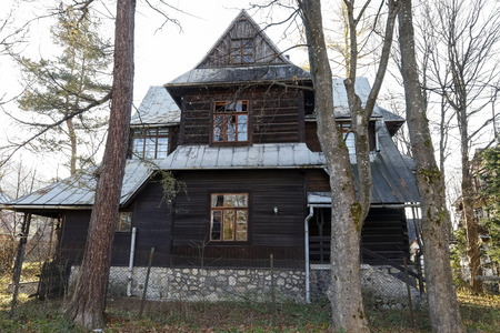 Zakopane, Poland - November 17, 2018: A large and old family house, which was built of wooden logs around 1927 is seen here on an autumn day.のeditorial素材